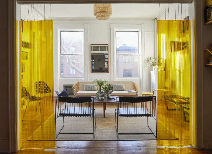 in his new york apartment, designer c. s. valentin opted for yellow strip  16