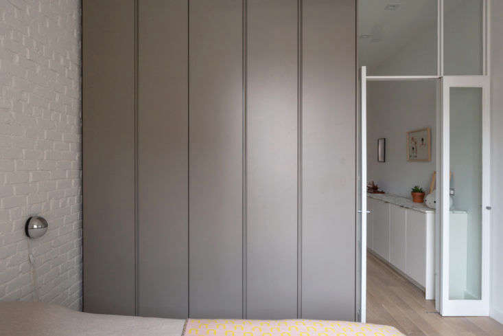a wardrobe alongside the bed looks sleek when closed. without so much as door p 17