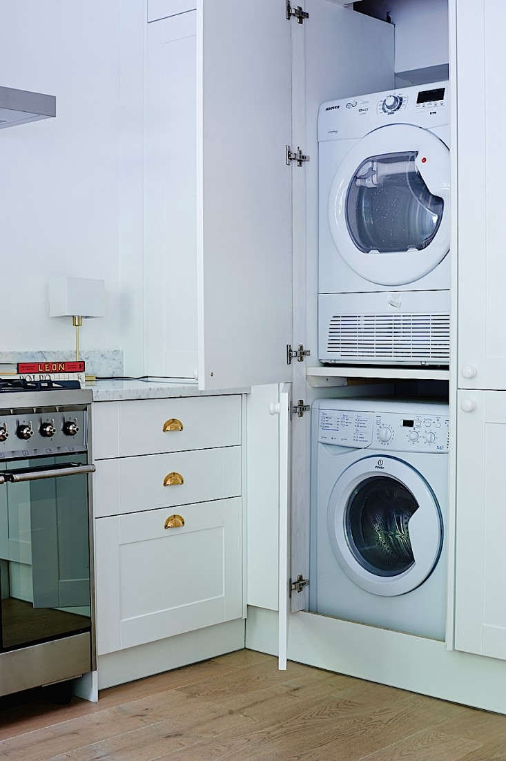 “Without a utility room in which to hide the washer/dryer, we had to steal space from the kitchen,” says Isabel Blundena of her incognito units. Photograph by Jonathan Gooch for Remodelista, from Rehab Diary, Part 3: A Small House Overhaul in London, the Big Reveal.
