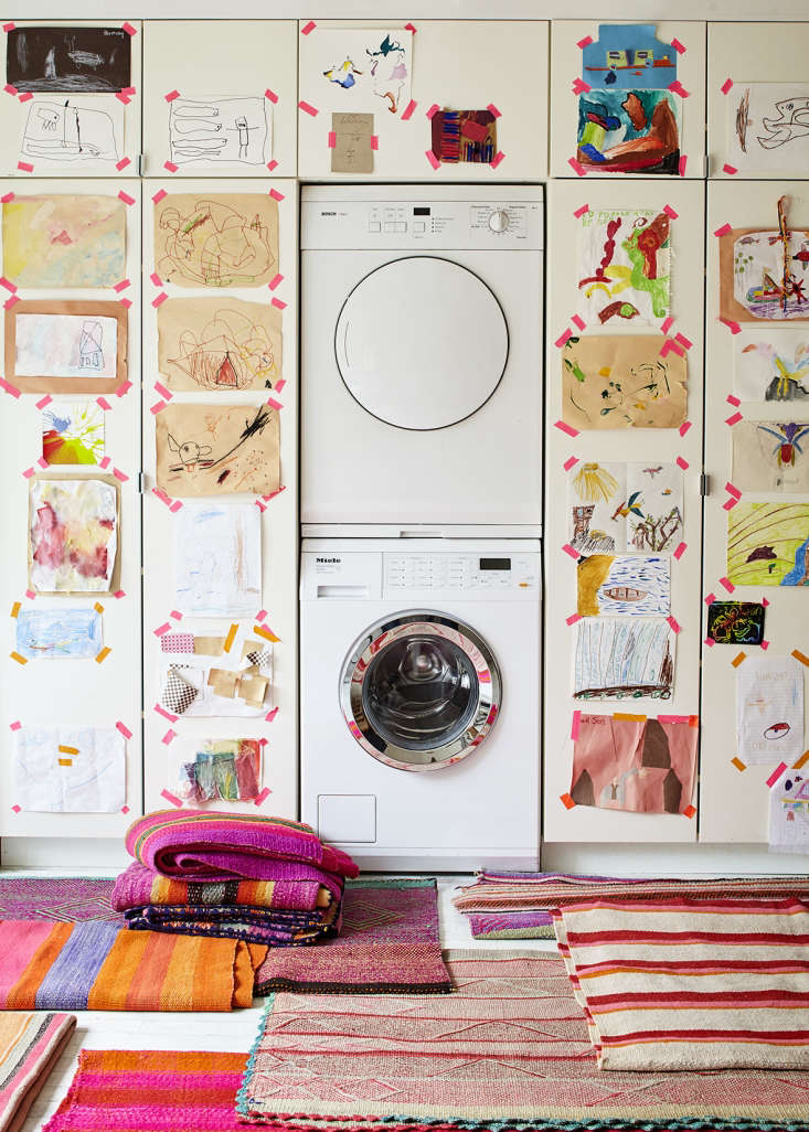 Here’s a counterintuitive way to seamlessly integrate a washer and dryer into a space—put them on display. Jenni Li, of online Peruvian textiles emporium Intiearth, surrounds her units, housed in her kitchen, with Ikea cabinets wallpapered with her kids’ artwork. Photograph by Dana Gallagher and styling by Helen Crowther, from Embrace the Bright: A Textile Shop Owner at Home in Brooklyn.