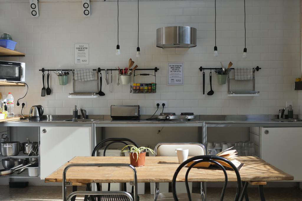 Steal This Look An Organized Hostel Kitchen In Barcelona Ikea Included - Wall Mounted Wooden Plate Rack Ikea