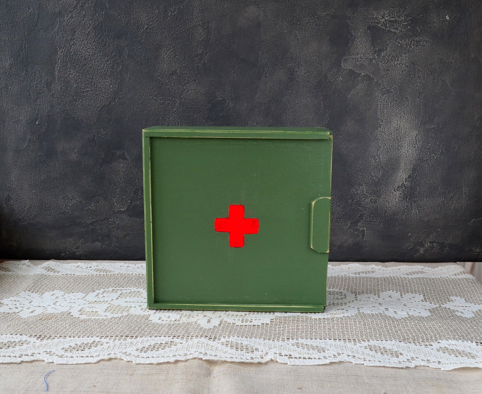 The Wood First Aid Box is $64.35 from LittleShopofDecorUA on Etsy.