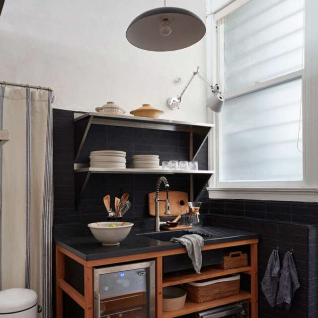 We designed each shelf space in the sink base shelving to fit specific appliances because the shelves are not adjustable. They’re built with mortise and tenon joinery,” says Lynn Kloythanomsup of Bay Area-based @landedinteriors. “The striped curtain hides a multitude of sins! The clients store extra folding chairs, a stepladder, cloth shopping bags, extra wine bottles, and their aprons in the closet.”

📷 Photography by Mariko Reed courtesy of Landed Interiors & Homes
✍️ Words by @fanwinston

#kitchenstorage #kitchendesign #storagetips #kitchendesign #butcherblock #bayarea #landedinteriors